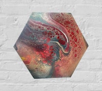 an abstract painting on a brick wall