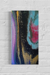 an abstract painting on a brick wall