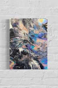 an abstract painting on a brick wall
