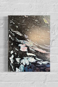 a black and white painting on a brick wall