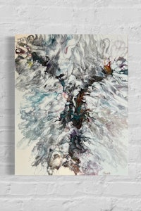 an abstract painting on a brick wall