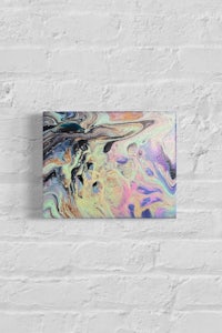 an abstract painting on a brick wall