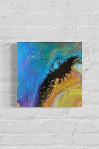an abstract painting on a brick wall
